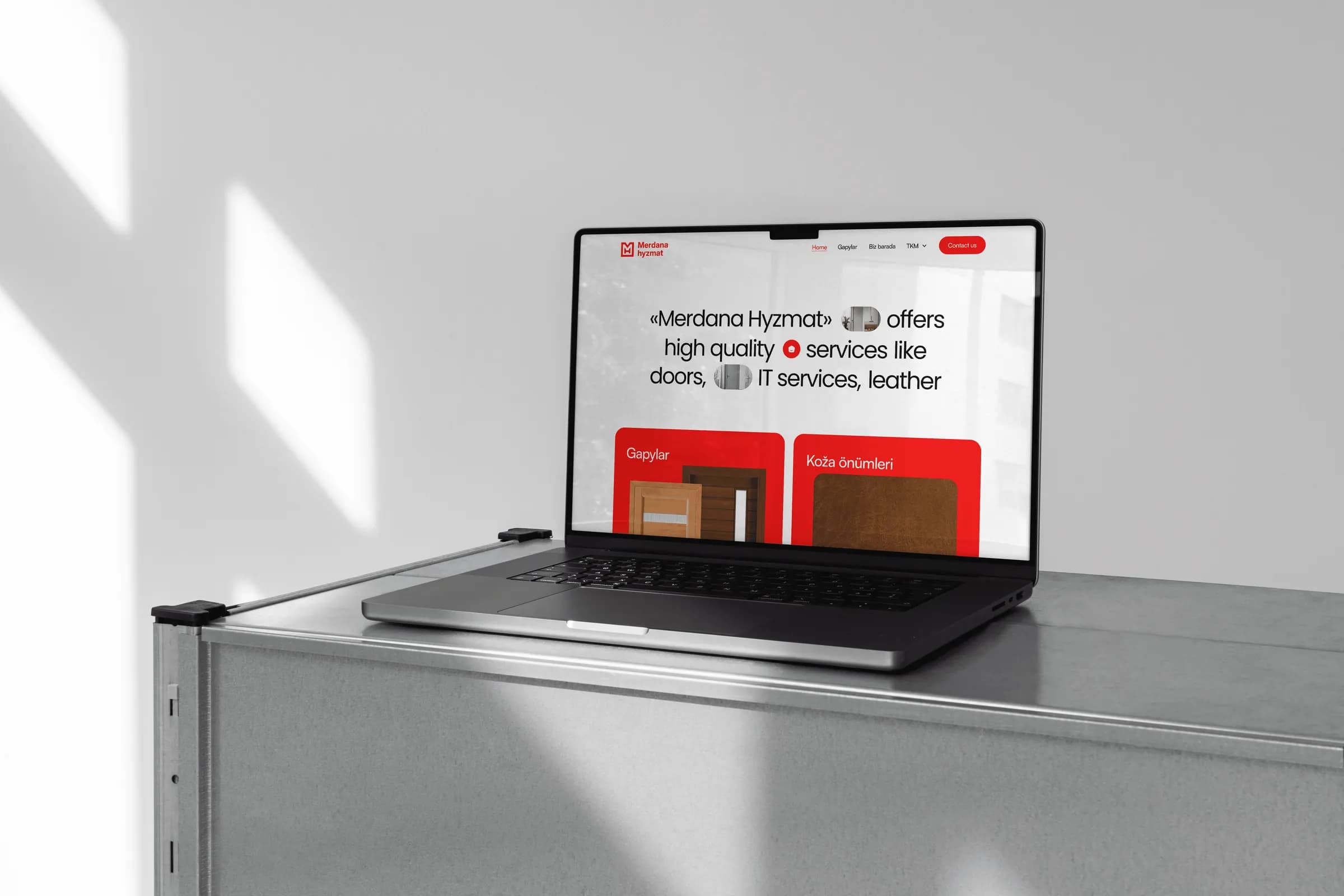 Merdana Hyzmat website on a laptop